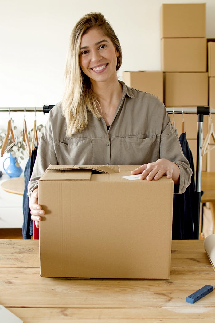 Woman Smiling while Holding the Package